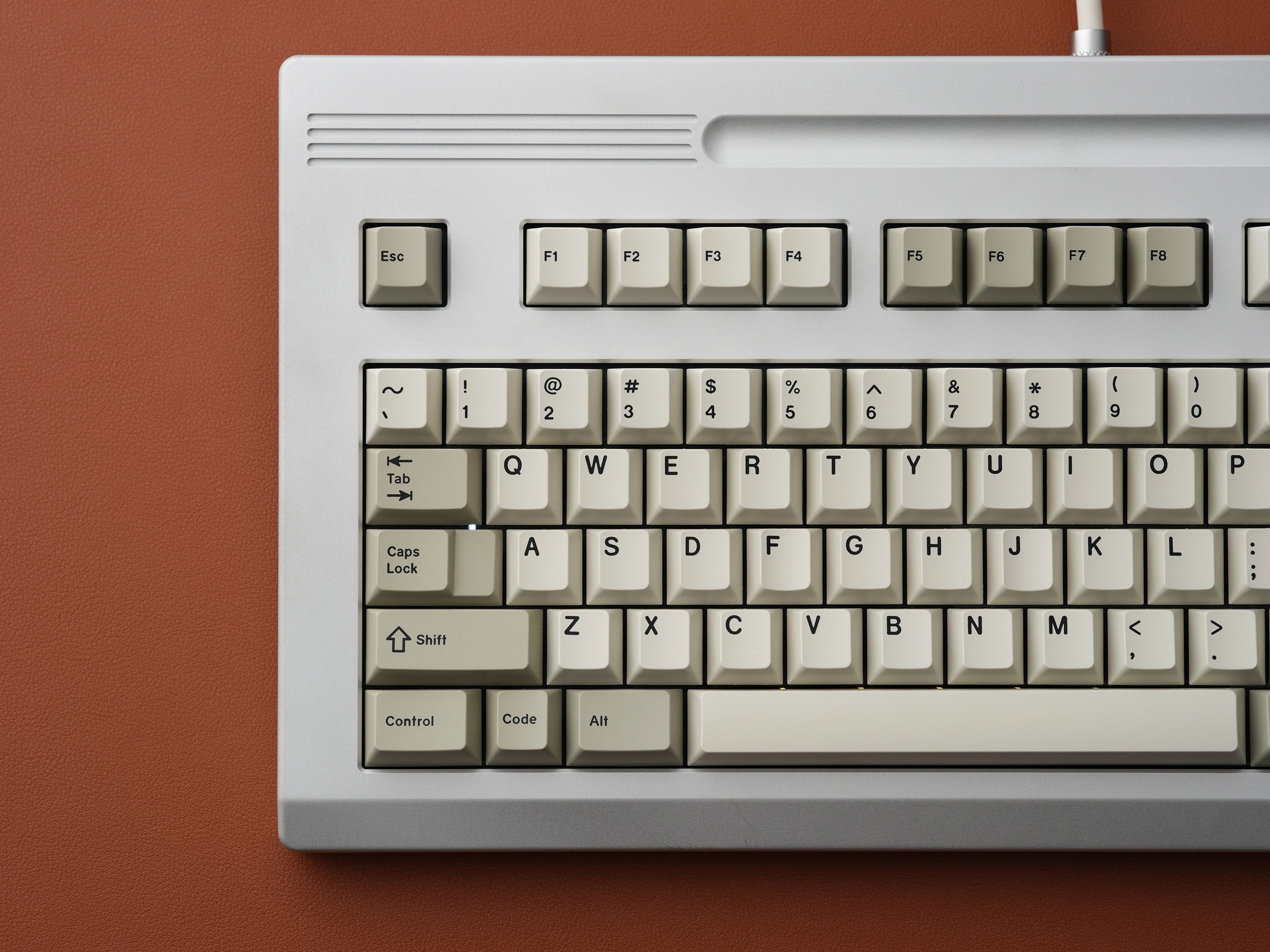 GMK CYL Classic Beige GMK CYL Classic Beige Keycaps – top view of beige keycaps on cream keyboard